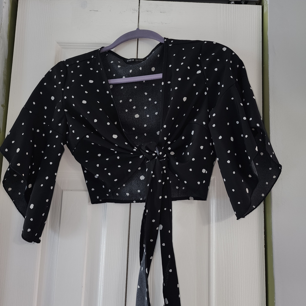 ThisBlack and White Polka Dot Tie-Front Crop Top Is Great For Festival Fun